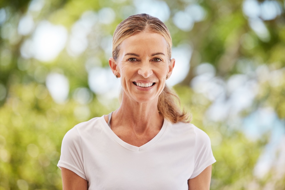 A healthy middle aged woman thanks to the benefits of hormone replacement therapy options for women in Atlanta and Woodstock, GA